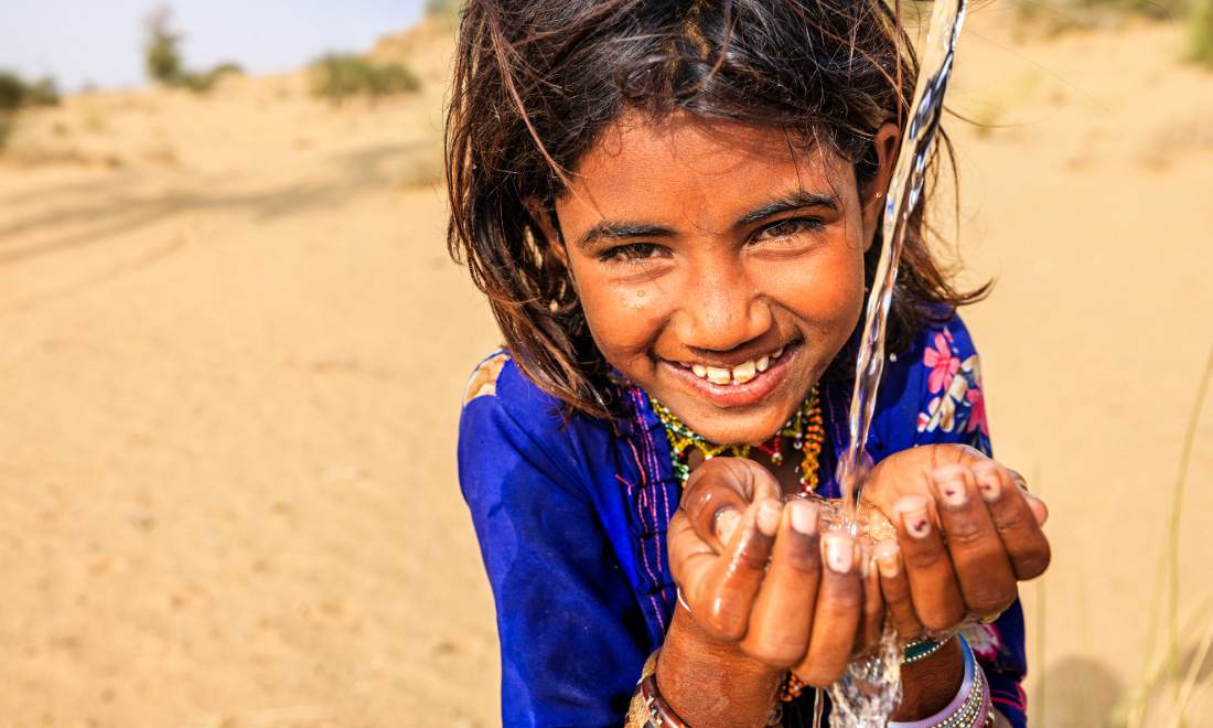 photo of girl with hands under running water